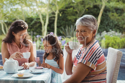 Happy family having tea