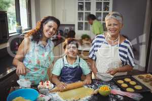 Family preparing dessert in kitchen