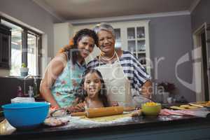 Family preparing dessert in kitchen