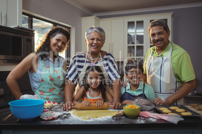 Happy family preparing dessert in kitchen