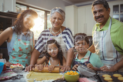 Happy family preparing dessert in kitchen