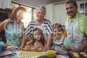 Happy family preparing dessert in kitchen