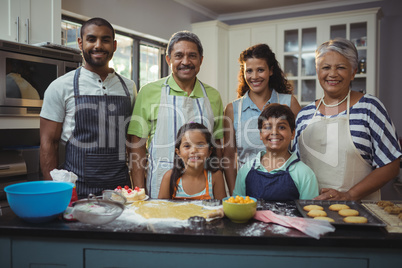 Happy family preparing dessert in kitchen