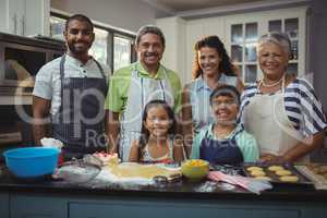 Happy family preparing dessert in kitchen