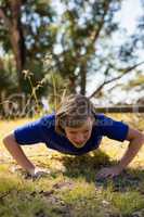 Girl exercising during obstacle course training