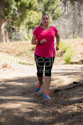 Woman jogging in the boot camp