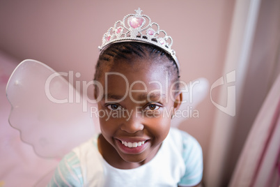 Portrait of smiling girl wearing fairy costume