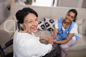 Portrait of patient with doctor at home