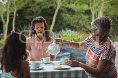 Happy family having tea