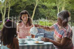 Happy family having tea