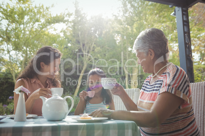 Happy family having tea