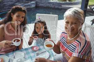 Happy family having tea