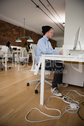 Executive working on computer in office