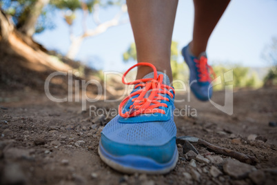 Low-section of woman jogging in the boot camp