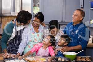 Happy multi-generation family enjoying in kitchen