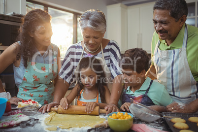 Happy family preparing dessert in kitchen