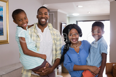 Smiling family in living room at home