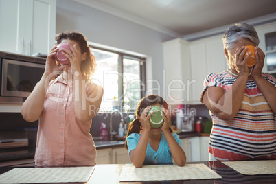 Family having soup in kitchen