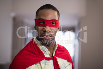 Portrait of man wearing superman costume