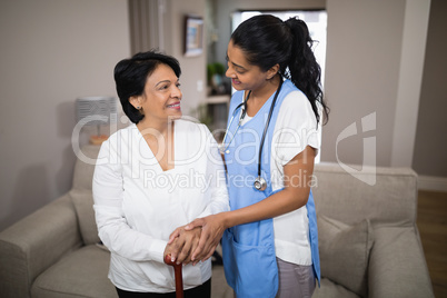 Young nurse standing with patient