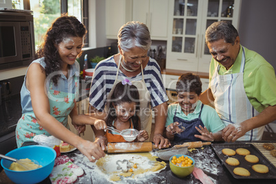 Happy family preparing dessert in kitchen