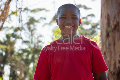 Boy standing in the boot camp during obstacle course training