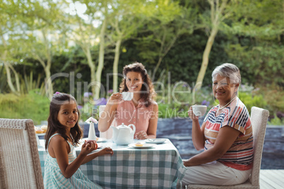 Happy family having tea