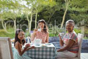 Happy family having tea