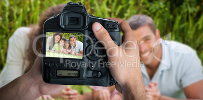 Composite image of cropped image of hands holding camera