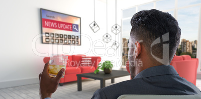 Composite image of rear view of businessman holding whisky glass