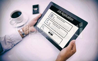 Composite image of man using tablet pc