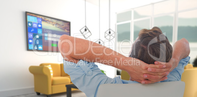 Composite image of rear view of male relaxing on chair