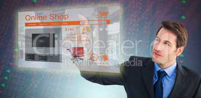 Composite image of serious businessman pointing at something