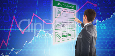 Composite image of focused businessman standing and pointing