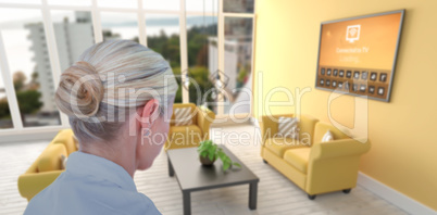 Composite image of rear view of businesswoman pointing