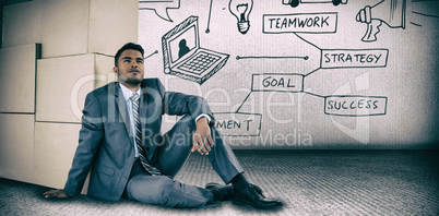 Composite image of businessman leaning on cardboard boxes against white background