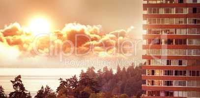 Composite image of scenic view of bright sun over clouds