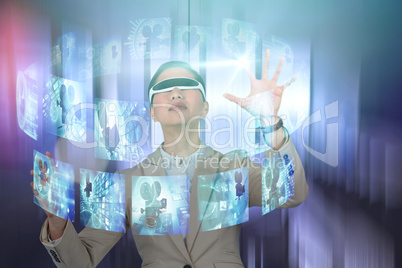 Composite image of businesswoman wearing virtual video glasses