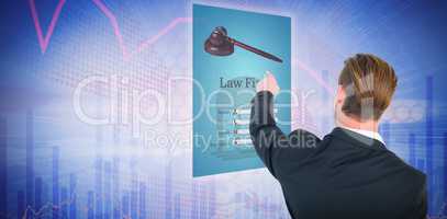Composite image of rear view of young businessman in suit pointing