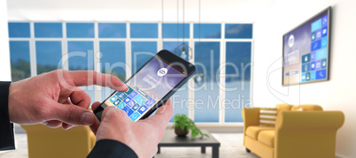 Composite image of businessman using smart phone