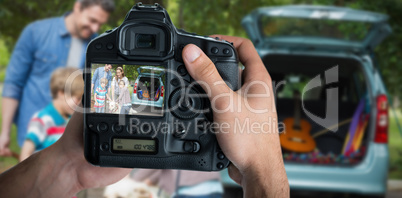 Composite image of cropped image of hands holding camera