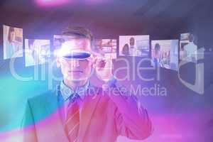 Composite image of handsome businessman virtual reality glasses
