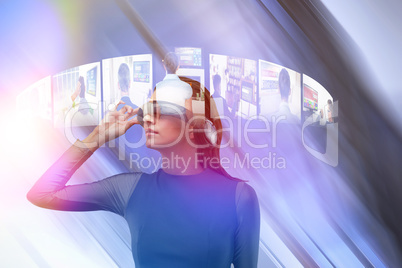 Composite image of woman wearing virtual reality glass