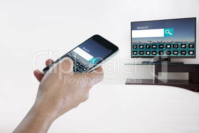 Composite image of close-up of hand holding mobile phone