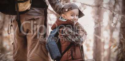 Portrait of happy boy holding hands with father