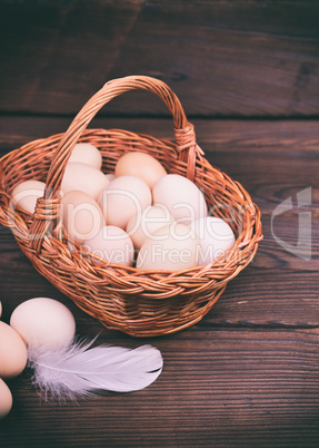basket with raw chicken eggs