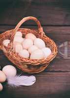 basket with raw chicken eggs