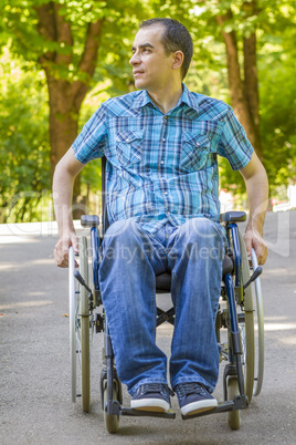 Young man in wheelchair outdoors