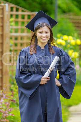 Graduated young woman smiling at camera