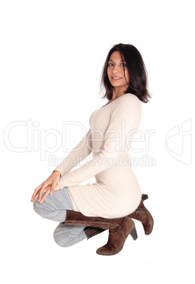 Happy Hispanic woman kneeling.